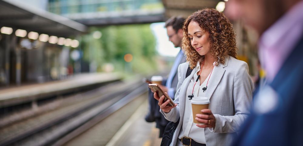 Woman using smartphone on commute